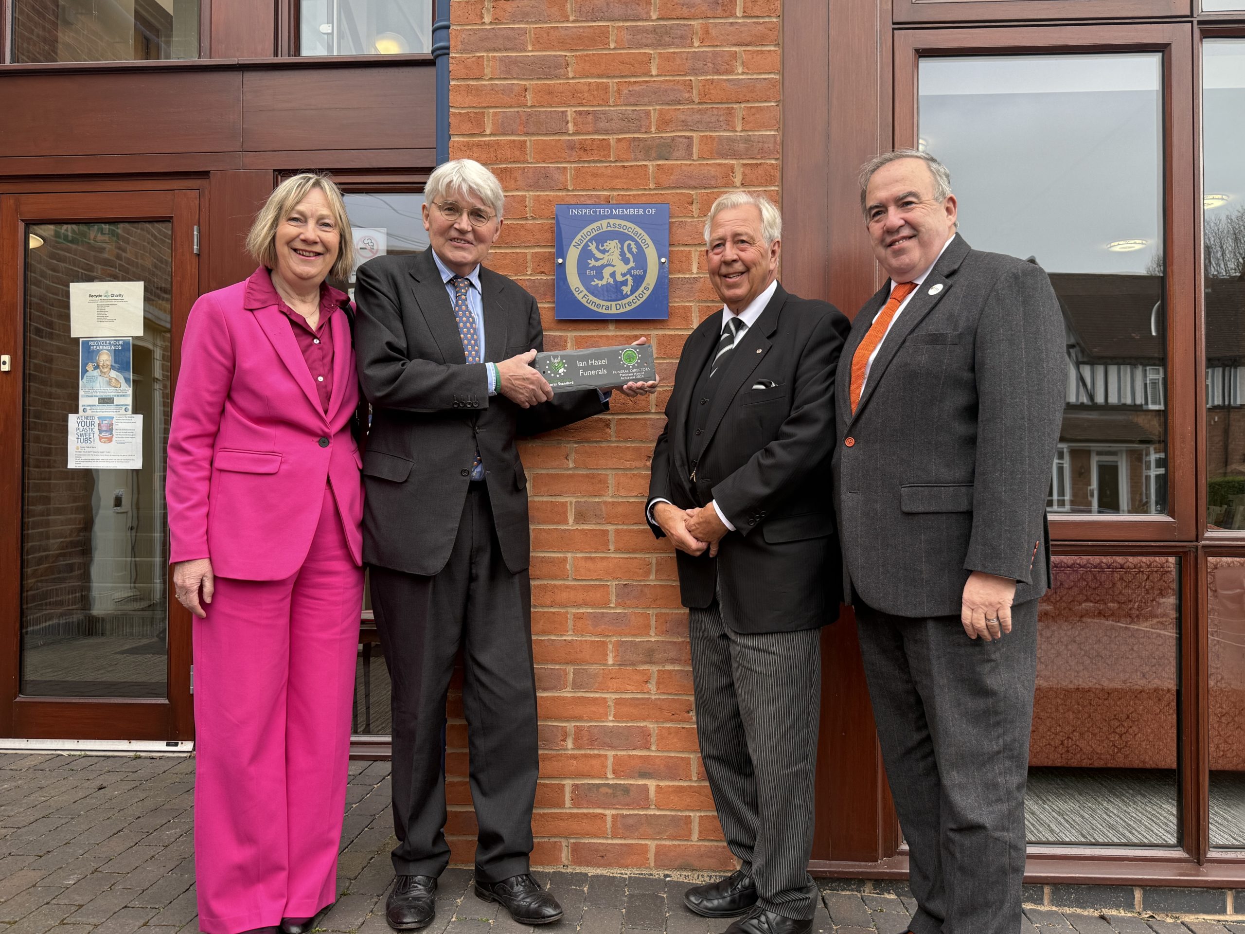 Ian Hazel accepting plaque from Greener Globe Funeral Standards with Andrew Mitchel MP